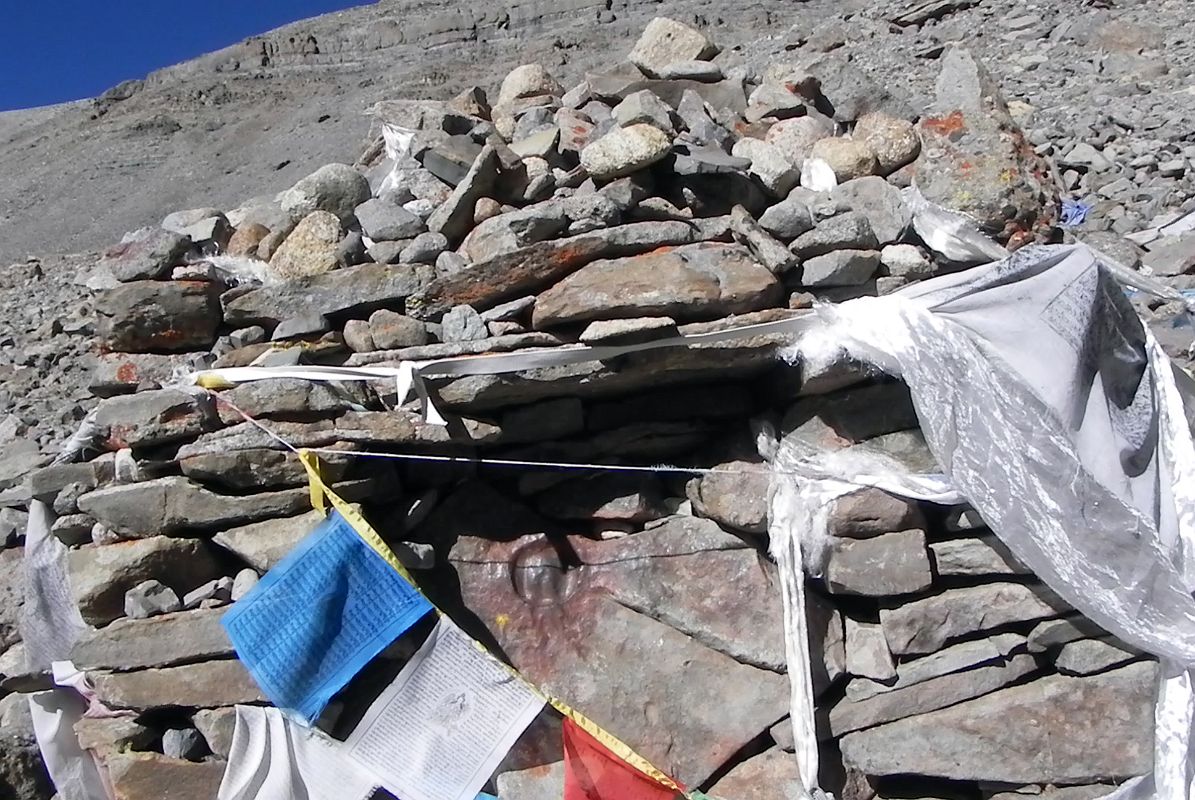 10 Prayer Flags And Horse Foot Print On Mount Kailash Inner Kora Nandi Parikrama Prayer flags over layered rocks identify an auspicious place for Tibetans - a horse foot print impressed onto a smooth rock (08:46, 5426m).